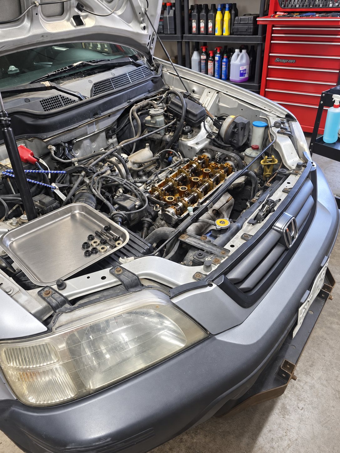 Valve cover removed to inspect the camshaft and rockers during diagnosis